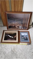 Three framed photos.