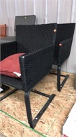 Set of 2 woven indoor/ outdoor arm chairs w/ one