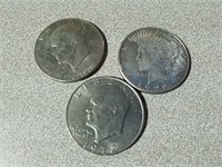 1922 S Peace dollar and two Ike dollars 1972 and