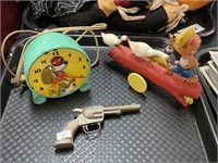 Alarm clock, Goose Boy, toy gun.