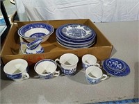 Blue and white plates, cups and other dishware