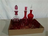 Three decanters with cordials sets