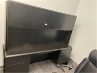 Black desk with overhead storage