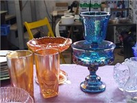 Carnival glass dishes.  Orange, and blue pieces.