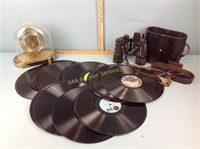 Records, binoculars, broken anniversary clock