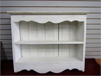 Wood shelf. Painted white.