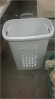 Tall white laundry basket on wheels