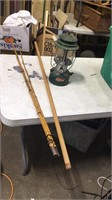 Coleman lantern, pole, wooden fishing pole