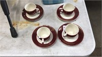 Blue tea pot, 4 red tea cups and saucers