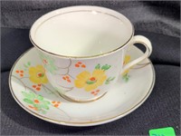 pretty cup & saucer, yellow flowers greenry