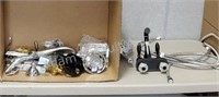 Assorted bathroom faucet, shower heads, hoses,