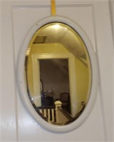 Antique painted white oval bevelled mirror