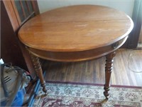 Round wood table with embellishments Applied wood