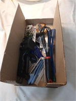 Box of kitchen utensils and magnets