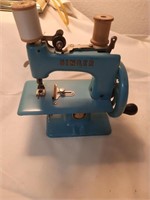 Singer blue hand crank toy sewing  machine works