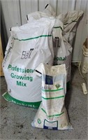 Bags of professional growing mix, ice melt