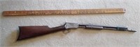 Old damaged gun and yard stick