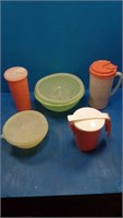 5 tupperware containers 1 strainer 3 mugs and 1