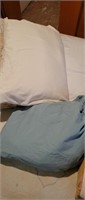 Random pillows, plus full sheet set in blue bag