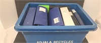 Recycle bin full of 3 ring binders