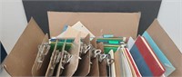 Box full of clip boards scriblers and file