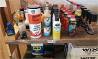 Shelf of WD-40, 2 Cycle Starting Fluid, & more