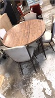 Table and 4 chairs. 1 leafs