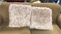 2 pink fuzzy pillows