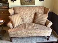 Wingback love seat with some wear