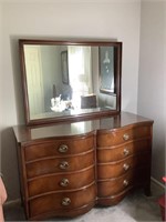 Dresser with glass top and attached mirror,