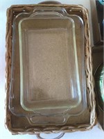 2 small glass cake pans and wicker basket