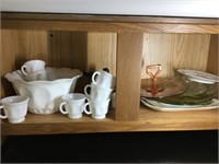 Contents of cabinet above refrigerator (milk