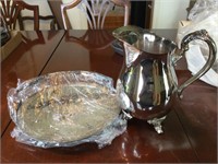 Silver water pitcher and tray