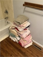 Large lot of towels and bathroom rugs