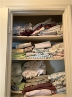 3 shelves of linens