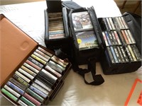 Large lot of cassettes and CDs. In cases