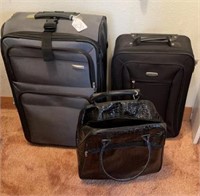Canvas suitcases and carry-on bag