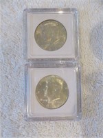 1964 AND 1964-D SILVER UNC. KENNEDY HALF DOLLARS
