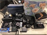 (4) 35mm Cameras, (1) Can Asstd Camera Items