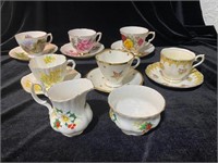 LOT - 6 TEA CUPS AND SAUCERS AND CREAM AND SUGAR