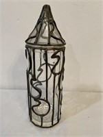 Glass container with metal trim