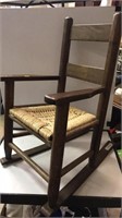 Child size wood rocker w/ woven seat.