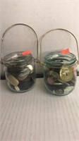 2 small jars w/ buttons. Jars have bail handles