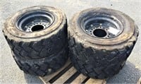 (4X) 10-16.5 Foam Filled Tires on 8 Lug Rims