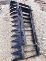 Unused brush rake for skidsteer