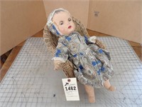 Antique  doll & wicker chair