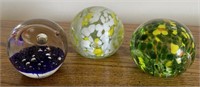 3 decorated paperweights