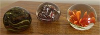 3 smaller decorated paperweights