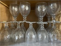 Shelf of 21 Diamond pattern stemware glasses