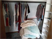 Clothes, blankets in closet